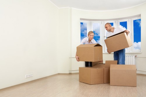 Movers handling furniture with care during relocation